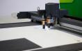 Digital,die,cutter,machine,cutting,pp,flute,board.,industrial,manufacture.