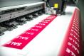 The,machine,prints,stickers,with,the,inscription,sale,,printing,production